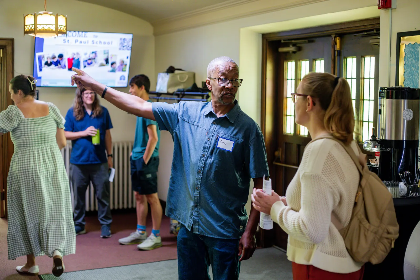 People greeting one another after Sunday worship at Emmaus